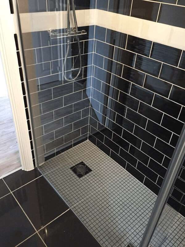 shower tray in bathroom - plumber cardington